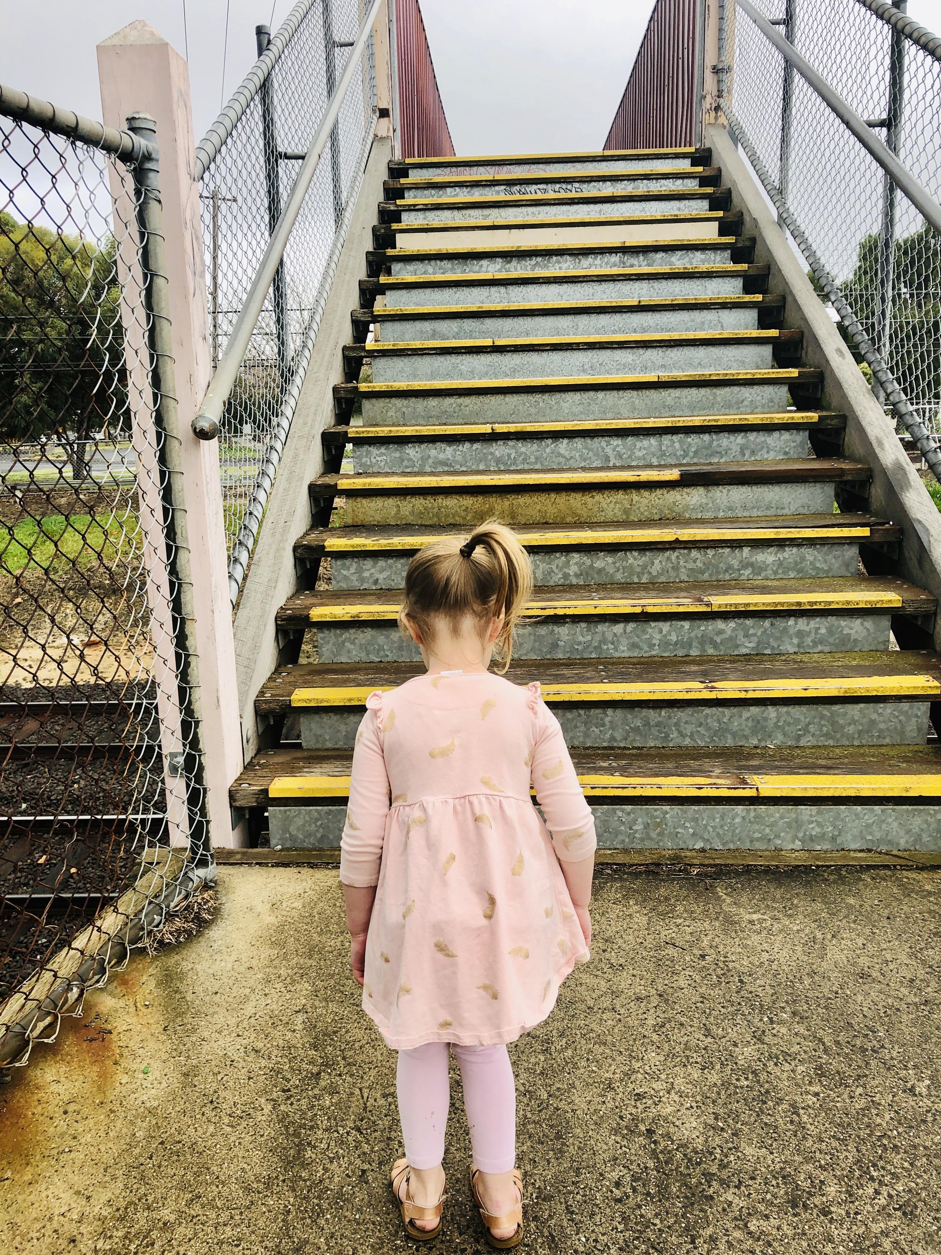 Girl counting stairs as she walks